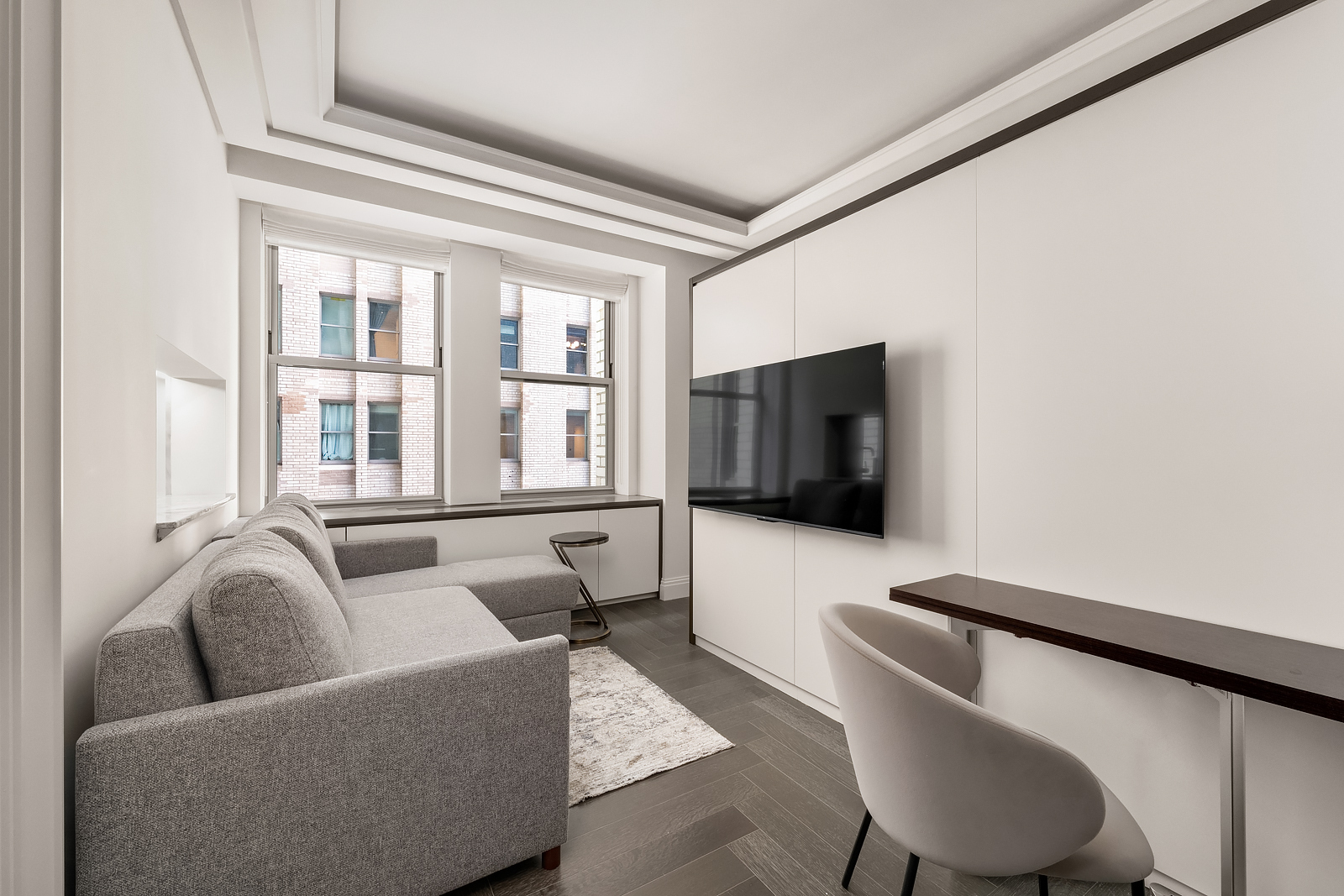 Undisclosed Address Manhattan, NY 10017 - Photo 2 of 16 a living room with furniture and a flat screen tv