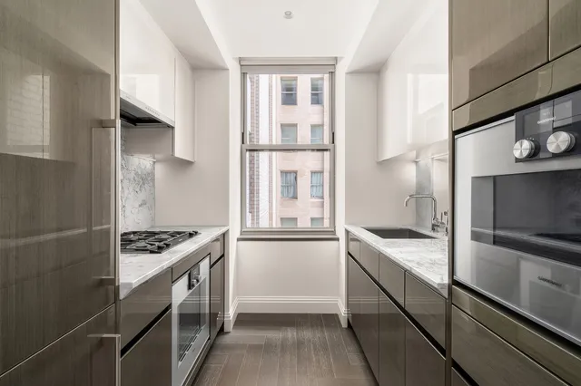 a bedroom with a bed and a chair