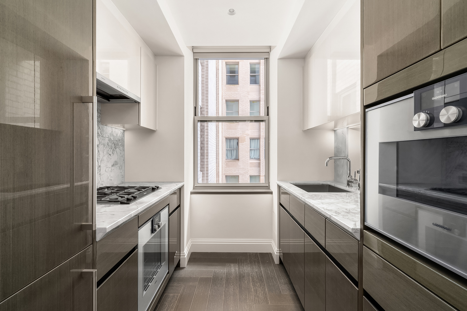 Undisclosed Address Manhattan, NY 10017 - Photo 5 of 16 a kitchen with stainless steel appliances granite countertop a sink and a stove