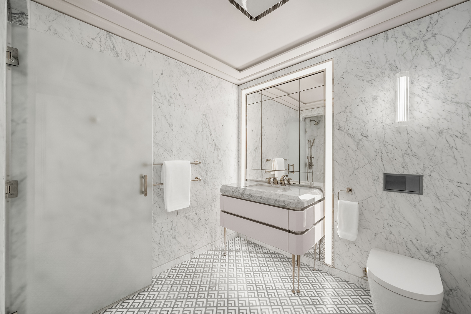 Undisclosed Address Manhattan, NY 10017 - Photo 6 of 16 a bathroom with a granite countertop sink a toilet and shower