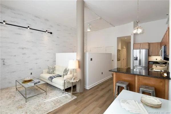 a living room with furniture and a table