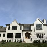 a view of house with yard