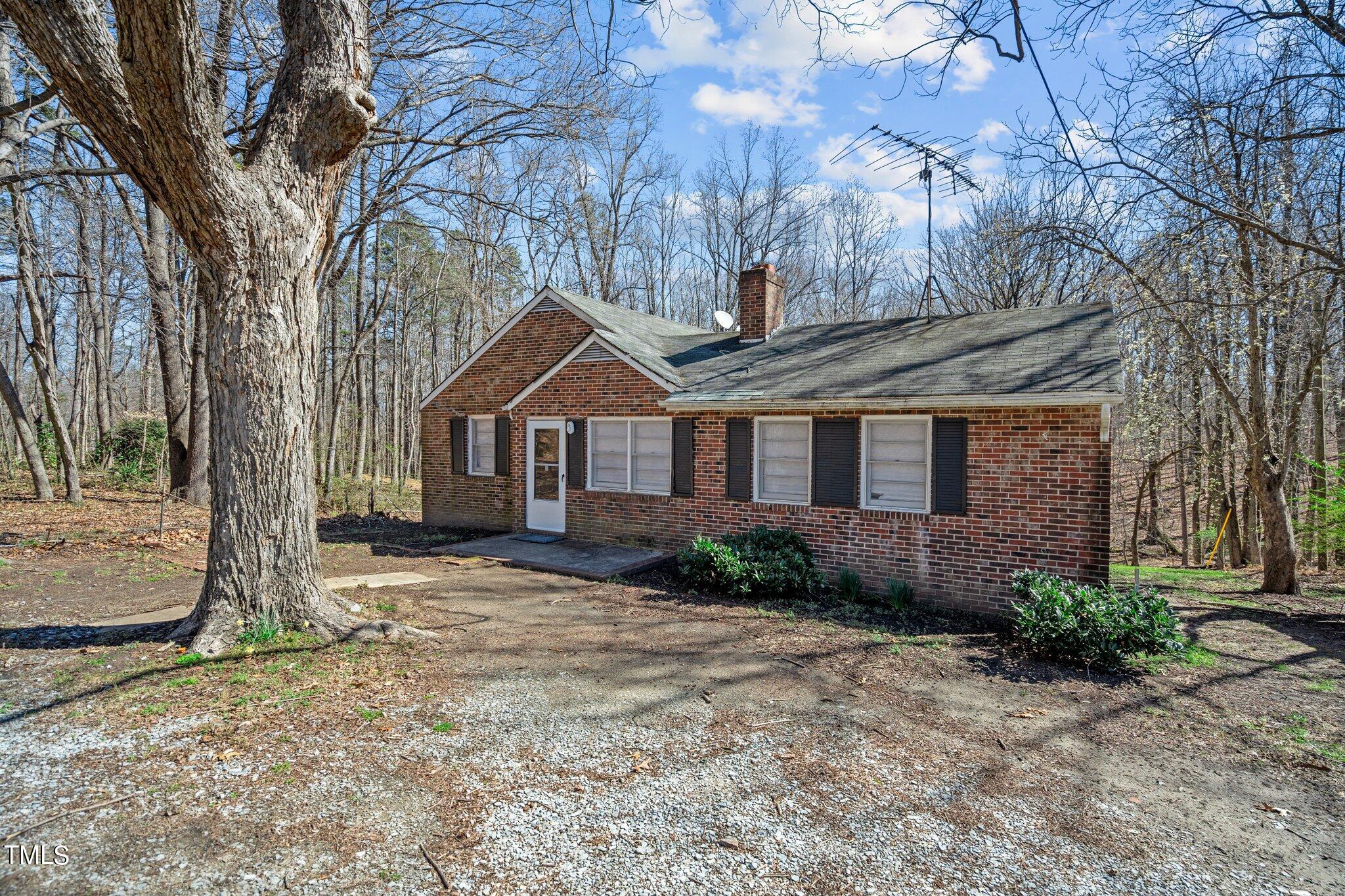 223 Gentry Street Roxboro, NC 27573 - Photo 2 of 36 a front view of a house with garden