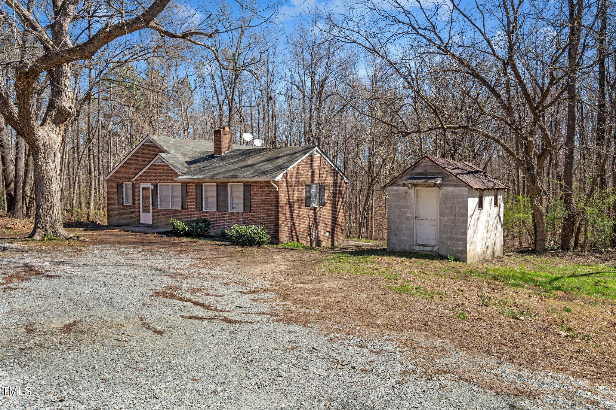 223 Gentry Street Roxboro, NC 27573 - Photo 29 of 36 a front view of a house with a yard