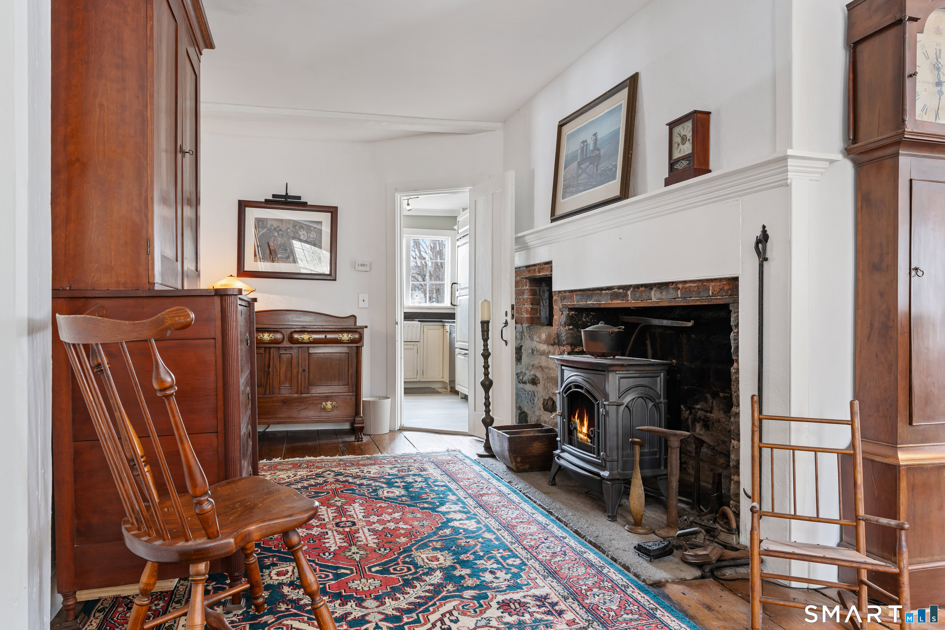 147 Boston Street Guilford, CT 06437 - Photo 12 of 32 a living room with furniture and a fireplace