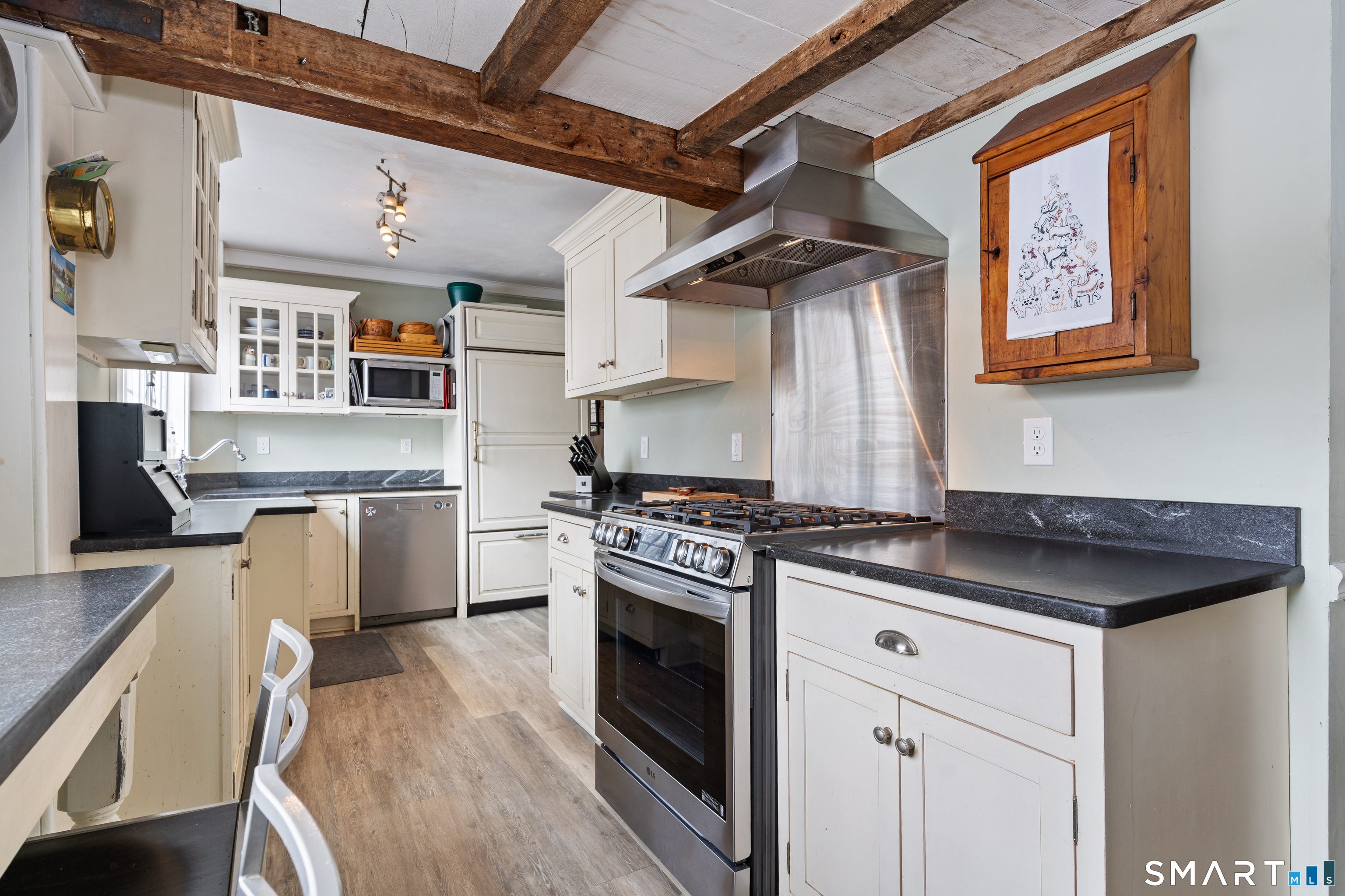 147 Boston Street Guilford, CT 06437 - Photo 13 of 32 a kitchen with stainless steel appliances granite countertop a stove and a sink