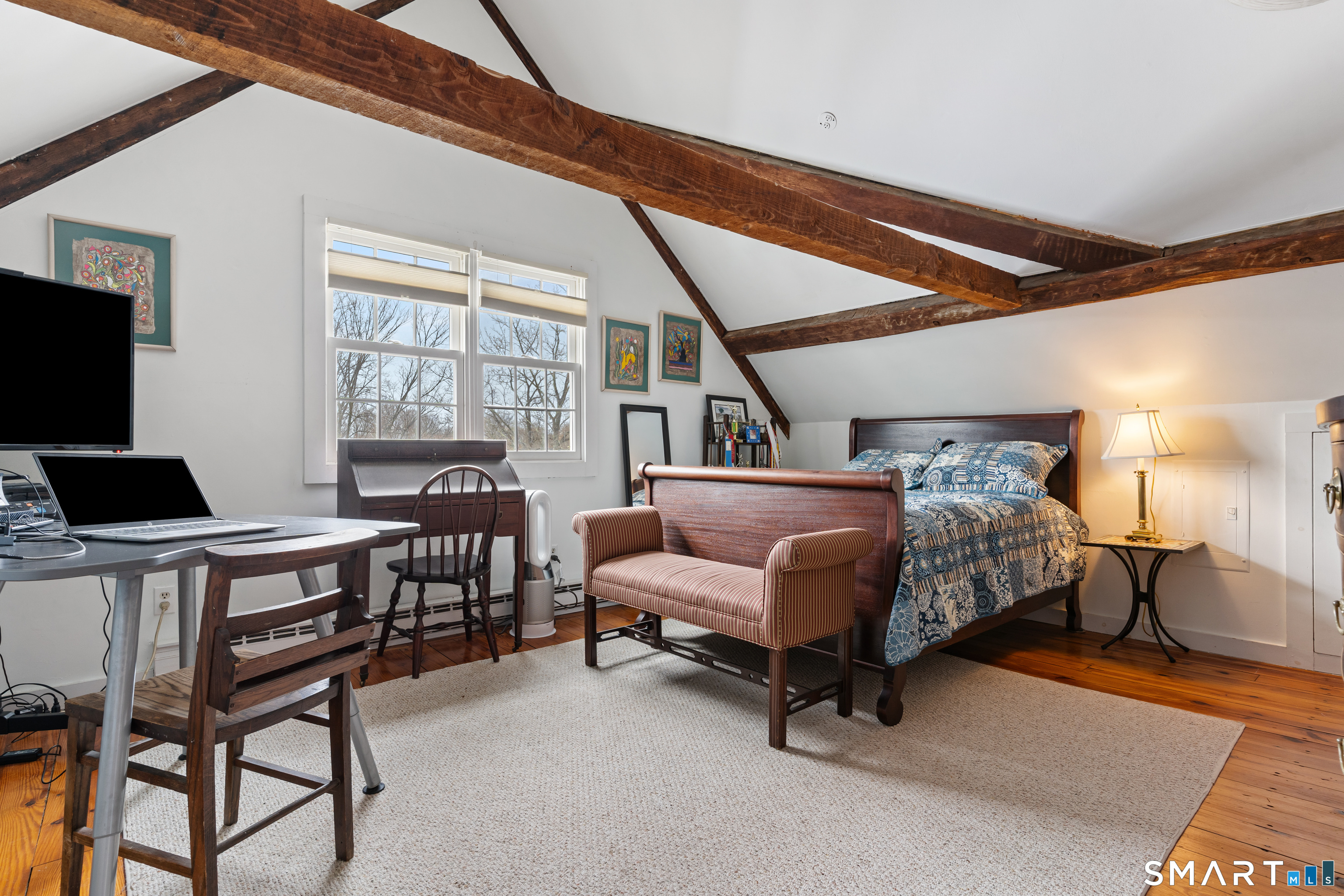 147 Boston Street Guilford, CT 06437 - Photo 19 of 32 a bedroom with furniture and a window