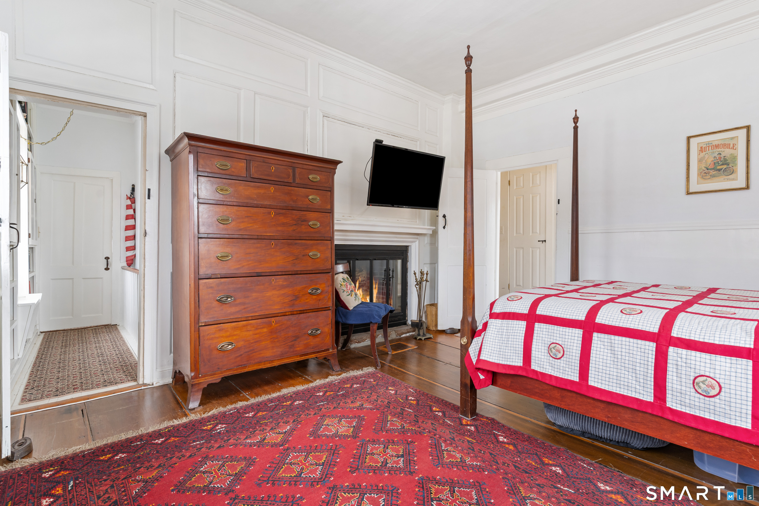 147 Boston Street Guilford, CT 06437 - Photo 20 of 38 a bedroom with a bed and a television