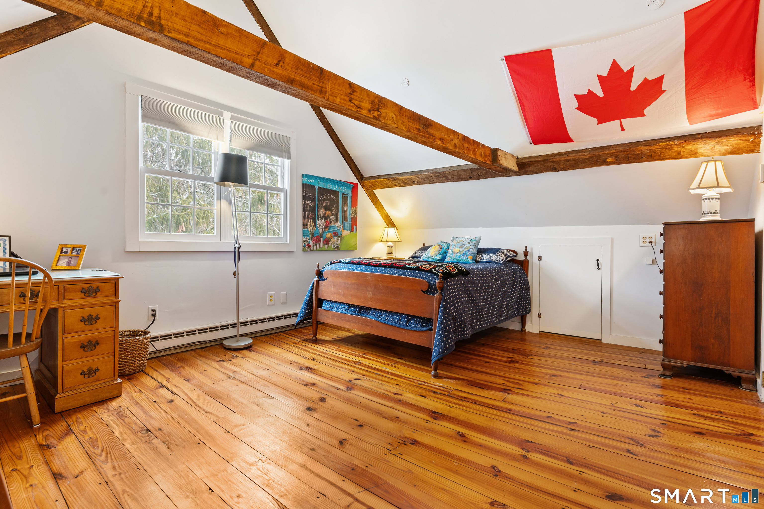 147 Boston Street Guilford, CT 06437 - Photo 21 of 32 a bedroom with a bed and a window