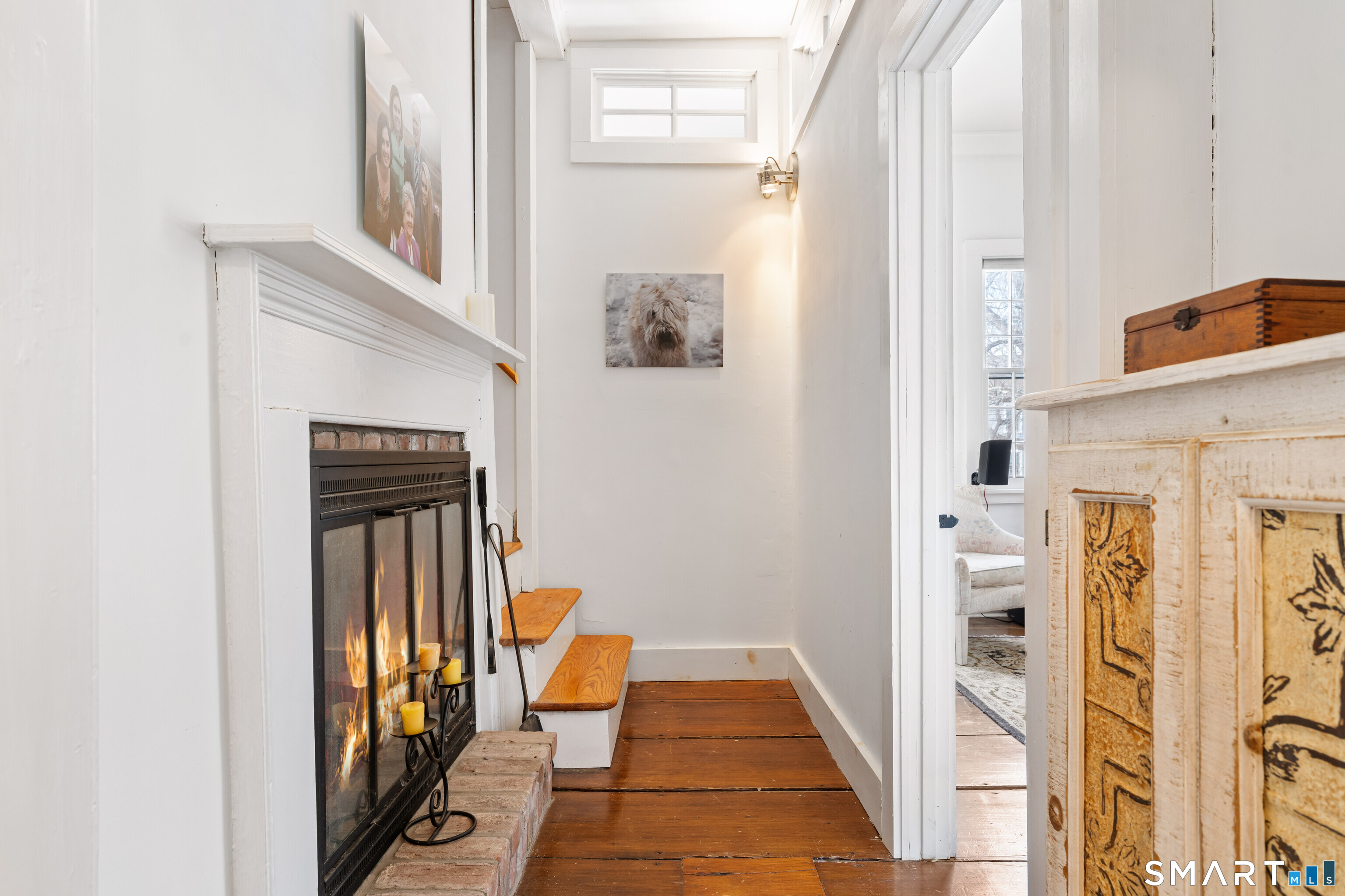 147 Boston Street Guilford, CT 06437 - Photo 27 of 38 a view of a hallway with wooden floor and entryway