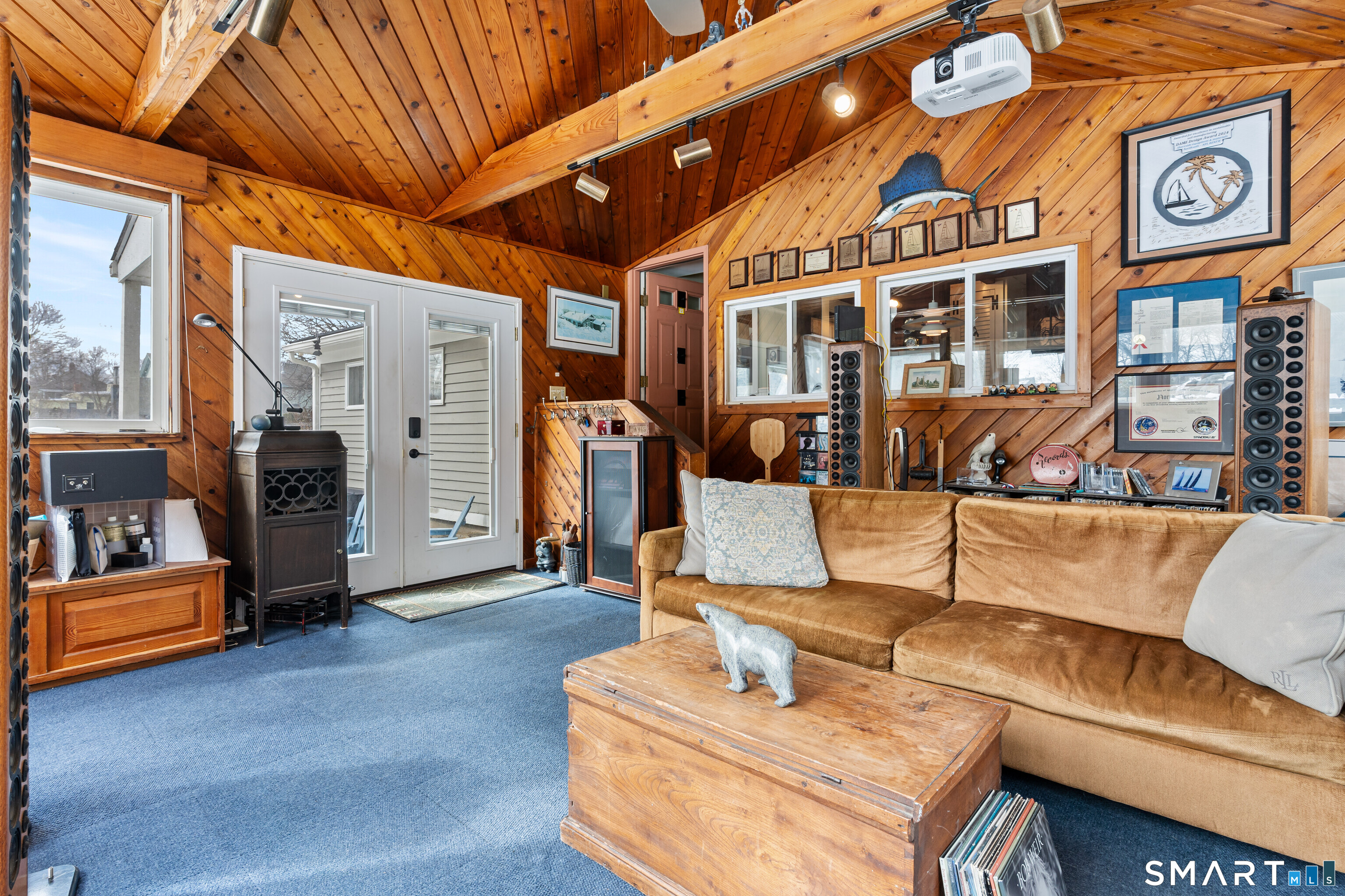 147 Boston Street Guilford, CT 06437 - Photo 27 of 32 a living room with furniture and a gym