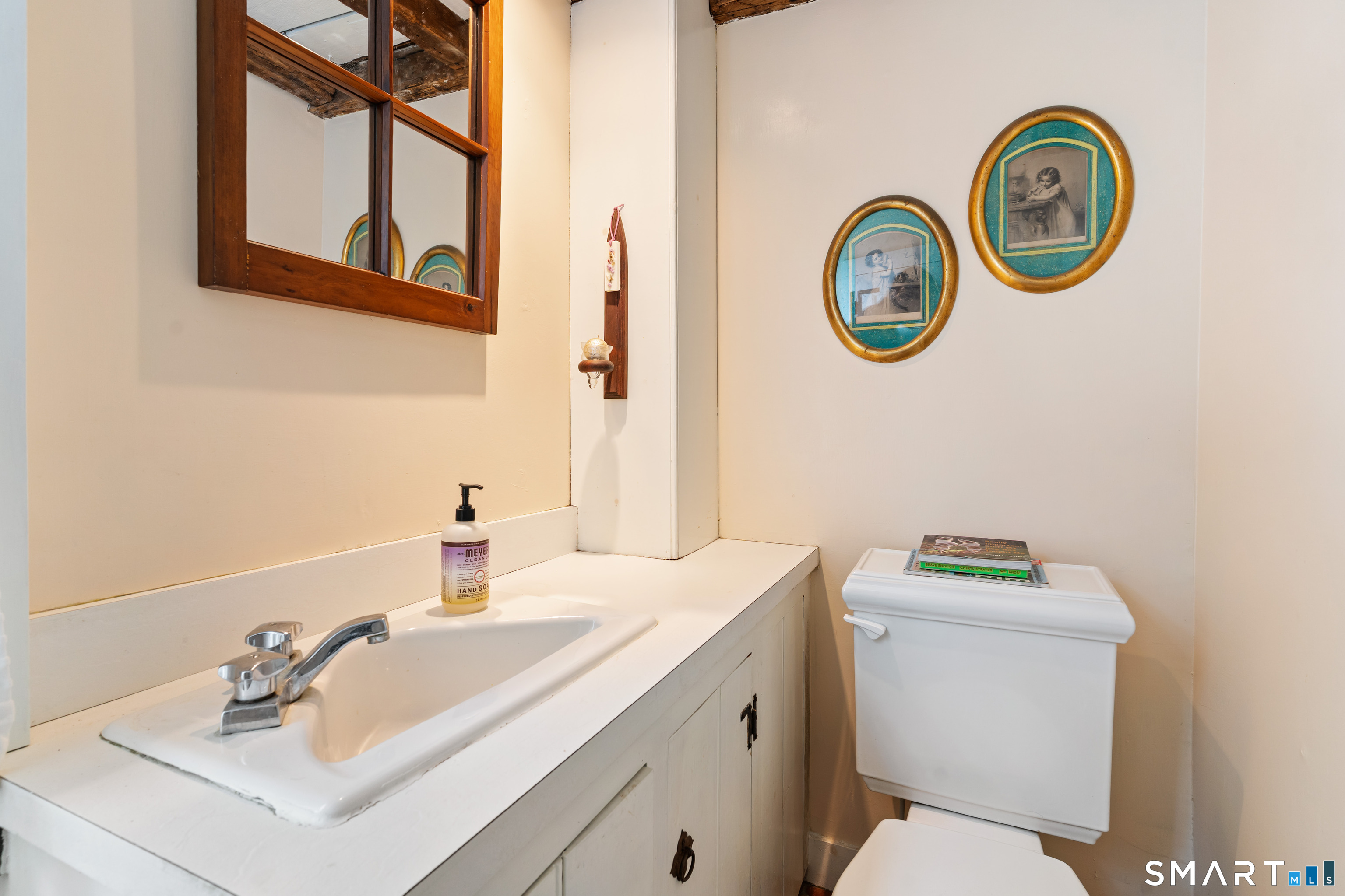 147 Boston Street Guilford, CT 06437 - Photo 28 of 32 a bathroom with a sink and a toilet