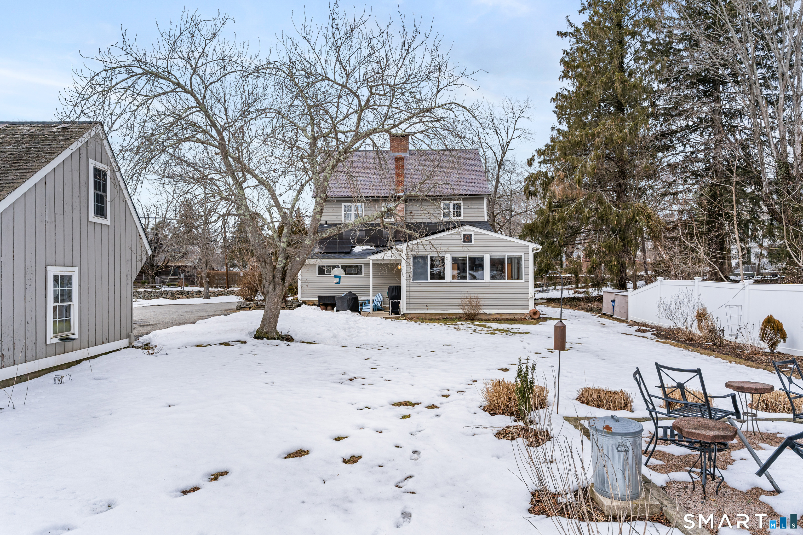 147 Boston Street Guilford, CT 06437 - Photo 31 of 32 a front view of house with yard covered in snow