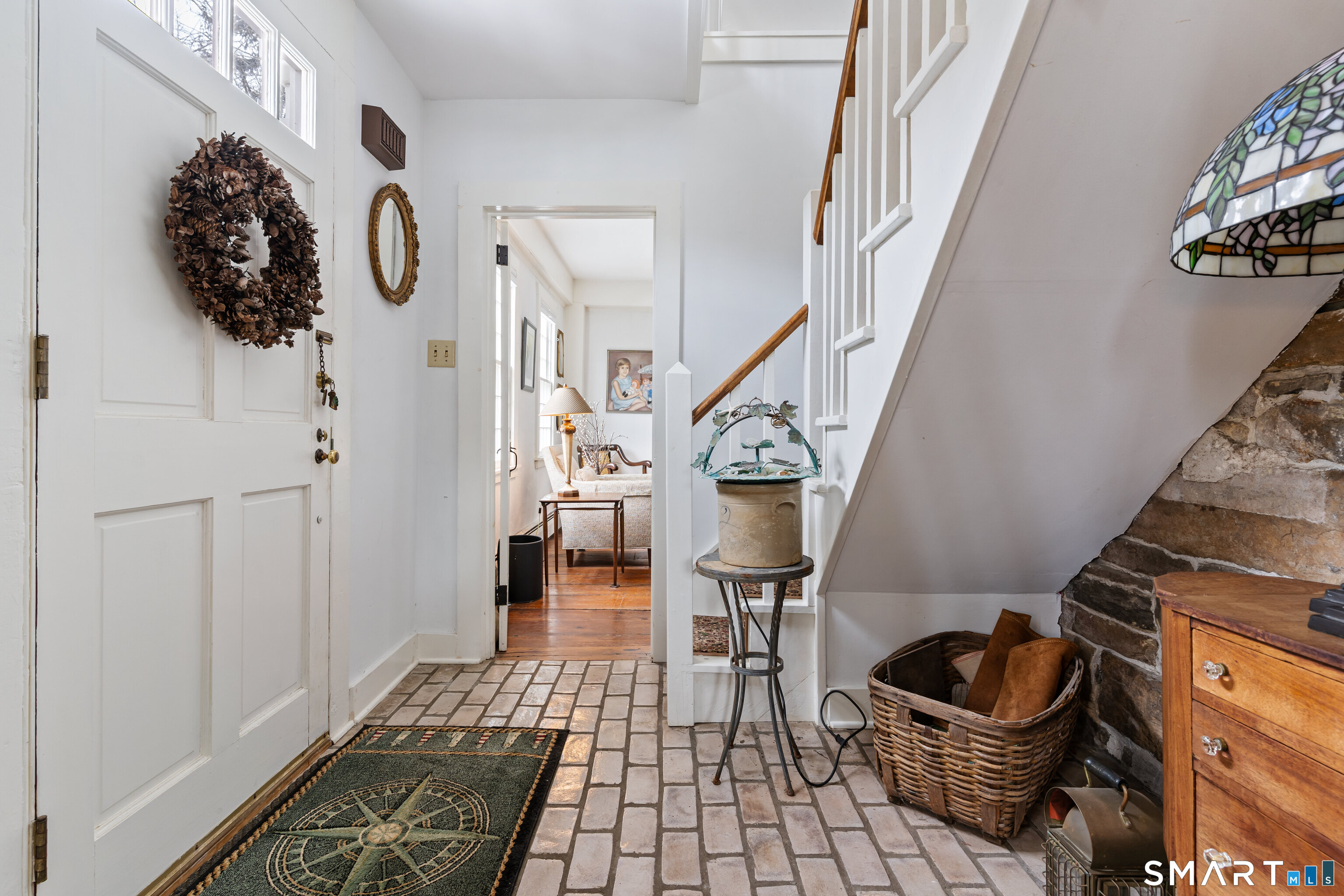 147 Boston Street Guilford, CT 06437 - Photo 9 of 32 a room with lots of chairs and a rug