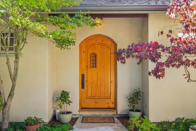 a dining room with furniture water view and a potted plant
