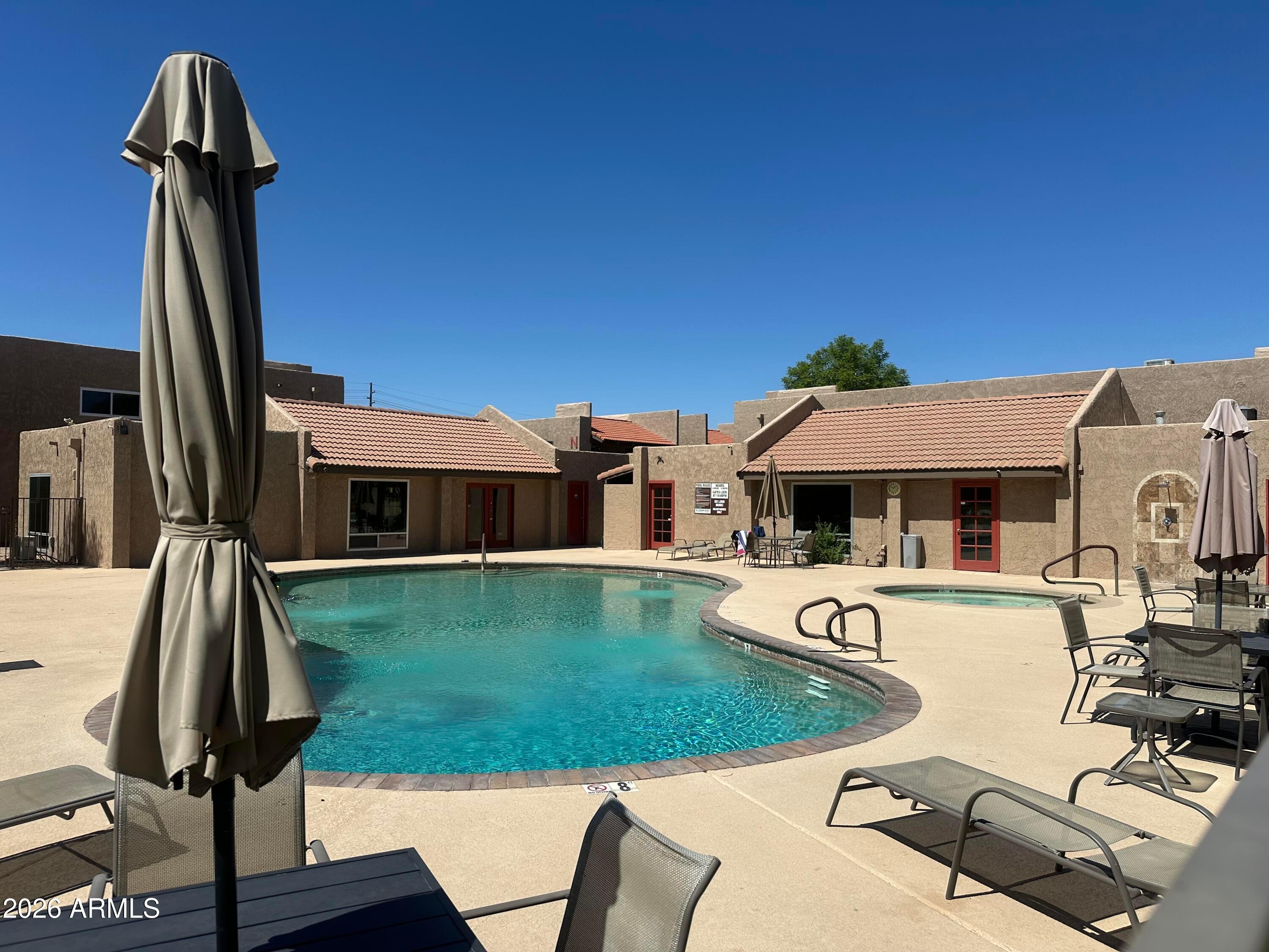 5525 East Thomas Road, Unit R8 Phoenix, AZ 85018 - Photo 21 of 21 a view of a house with pool porch and furniture