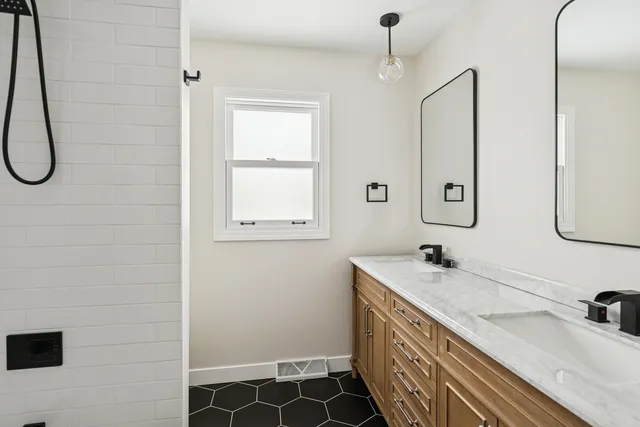 a bathroom with a sink a vanity and a mirror