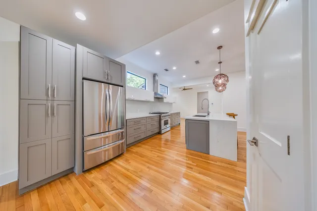 a kitchen with a table and chairs in it