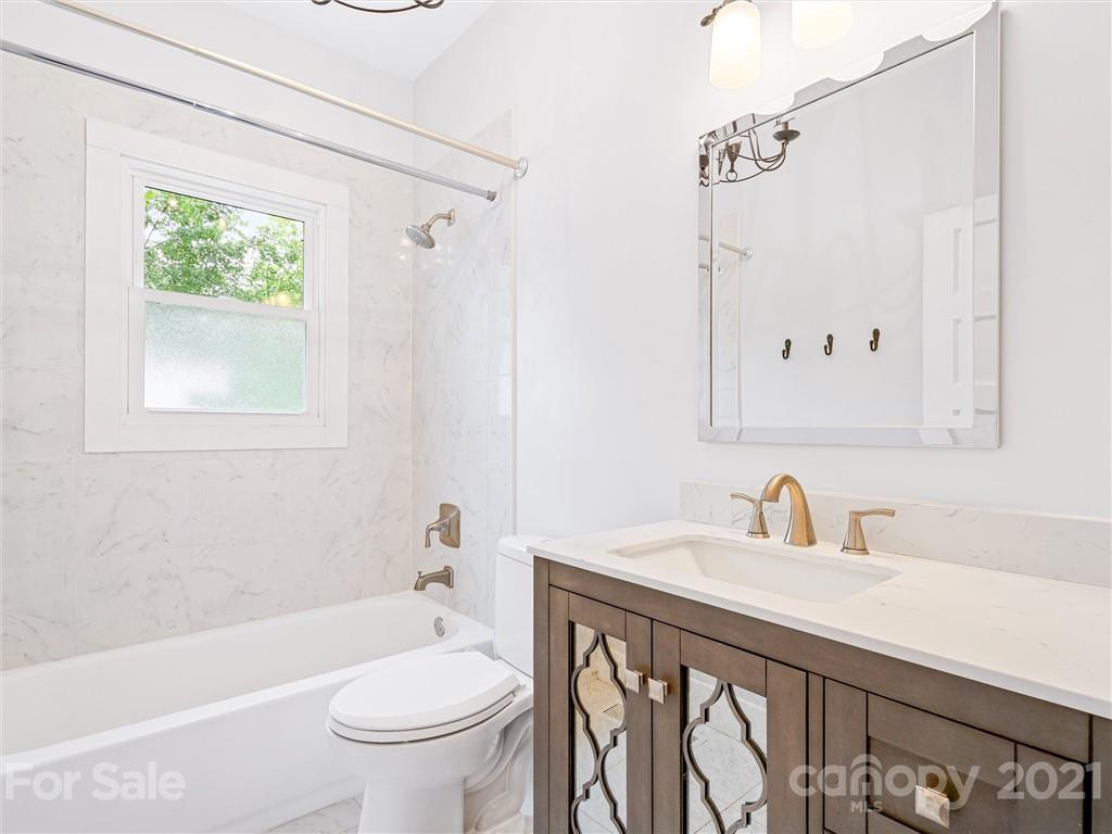 714 Queentown Road Canton, NC 28716 - Photo 13 of 21 a bathroom with a sink a toilet and a bathtub