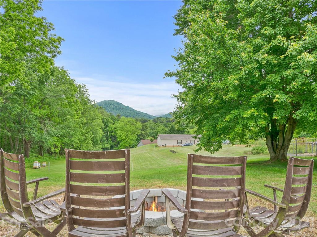 714 Queentown Road Canton, NC 28716 - Photo 18 of 21 a view of a chairs and table on the garden