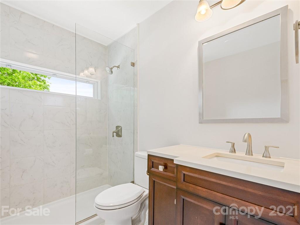714 Queentown Road Canton, NC 28716 - Photo 10 of 21 a bathroom with a sink a toilet and shower