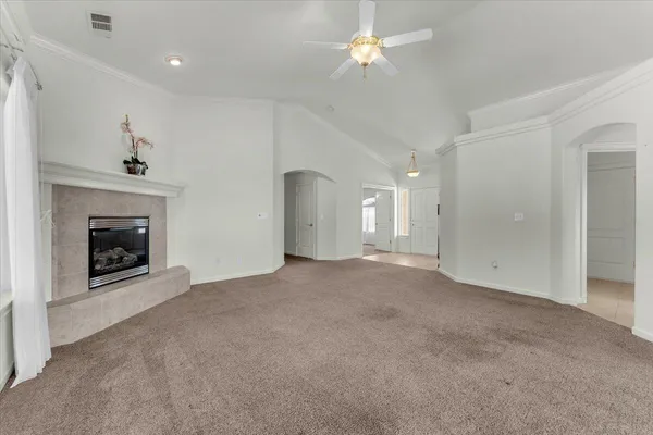 a view of an empty room with a window