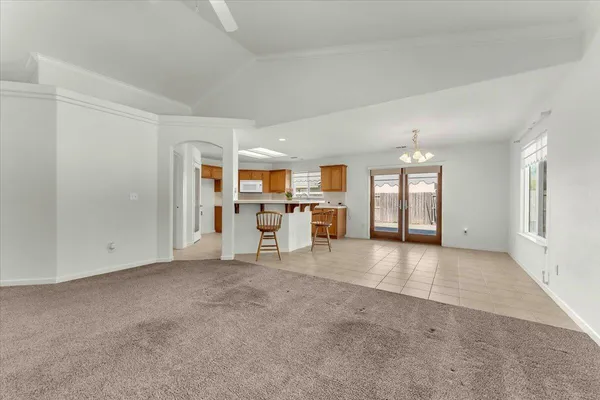 a view of empty room with a ceiling fan