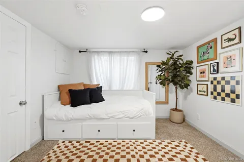 a spacious bathroom with a granite countertop sink a toilet and shower
