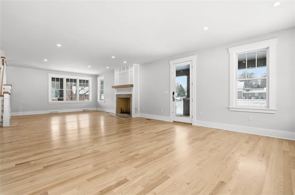 1502 Powers Run Road Pittsburgh, PA 15238 - Photo 12 of 33 a view of empty room with wooden floor and fireplace