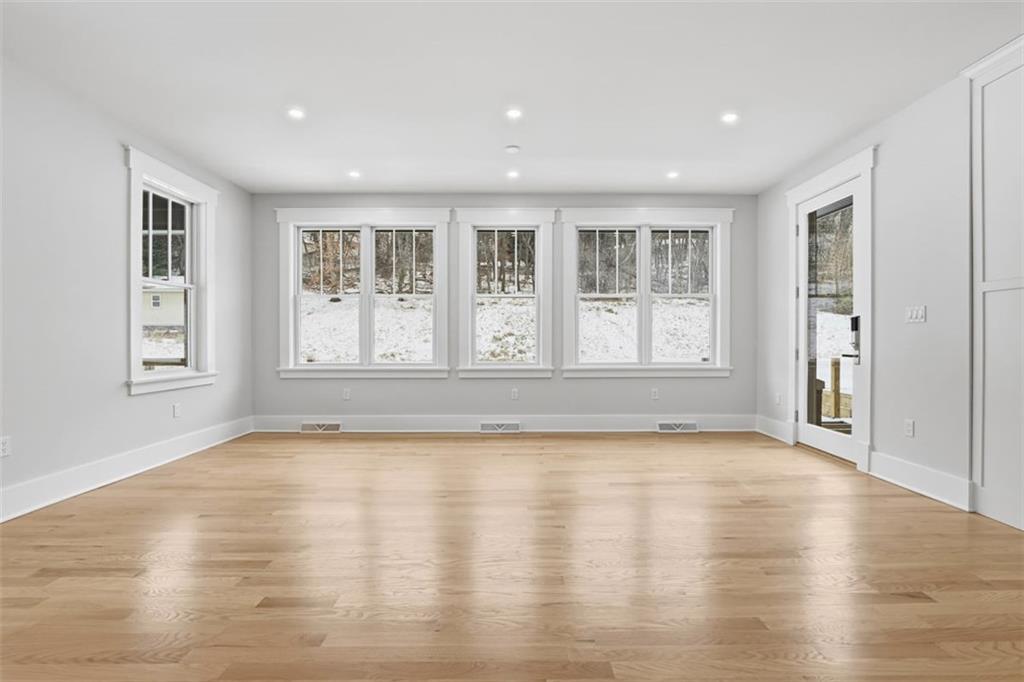 1502 Powers Run Road Pittsburgh, PA 15238 - Photo 13 of 33 a view of an empty room with a window and wooden floor