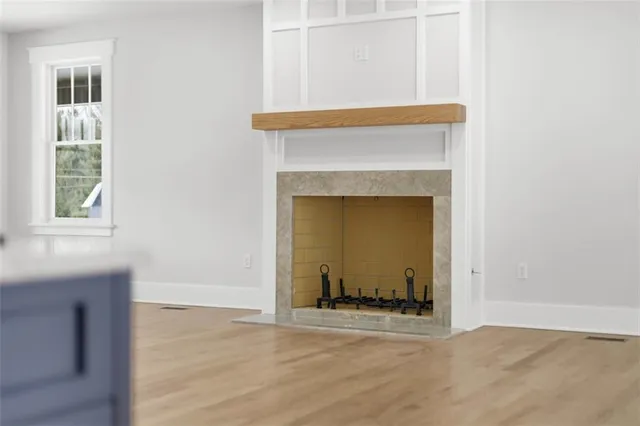 a living room with a fireplace and a window