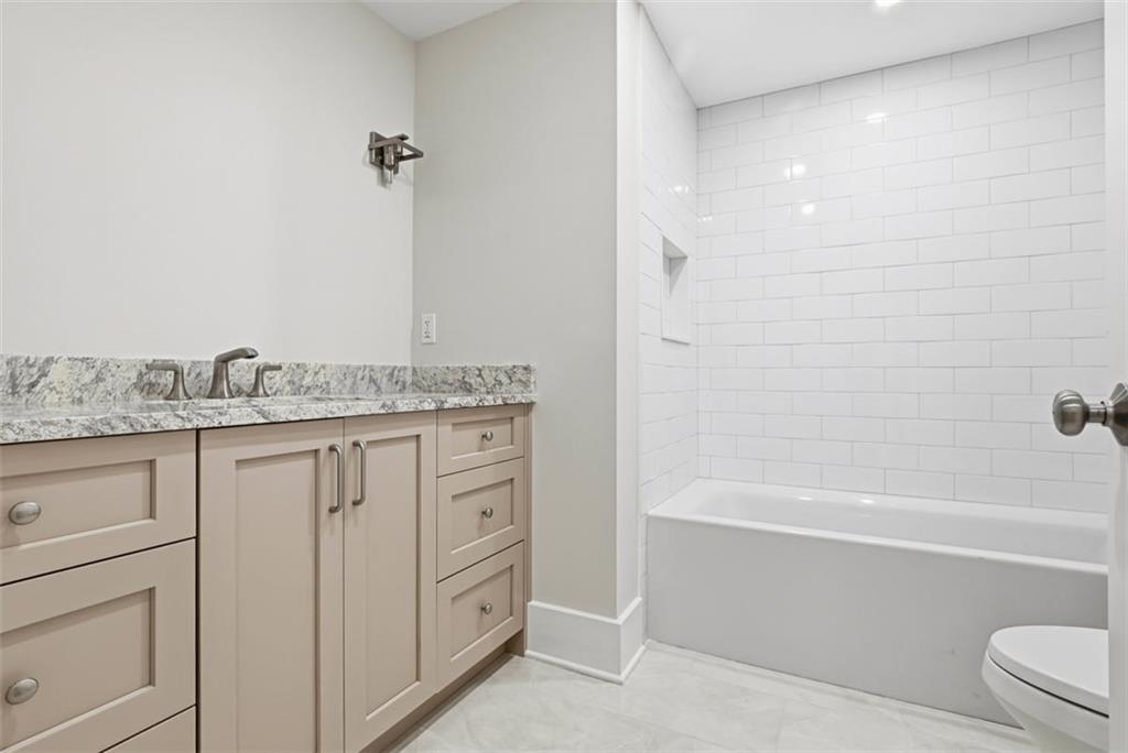 1502 Powers Run Road Pittsburgh, PA 15238 - Photo 28 of 33 a bathroom with a granite countertop sink a toilet and bathtub