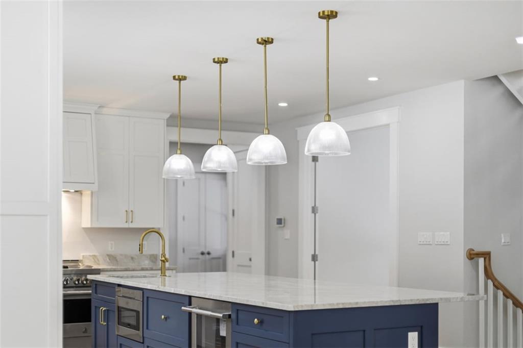 1502 Powers Run Road Pittsburgh, PA 15238 - Photo 3 of 33 a kitchen with a sink and chandelier