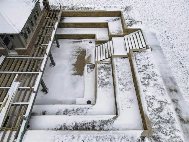 a view of staircase with white walls