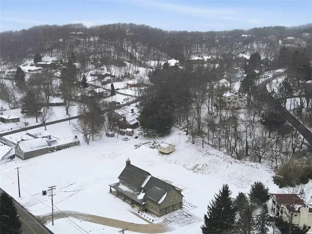 an aerial view of residential house with outdoor space