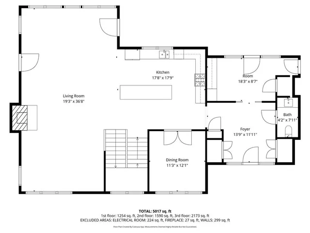 a black and white photo of a living room