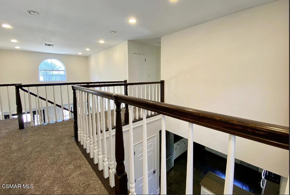 4130 Carrizal Road Woodland Hills, CA 91364 - Photo 15 of 33 a view of staircase with wooden floor and stairs