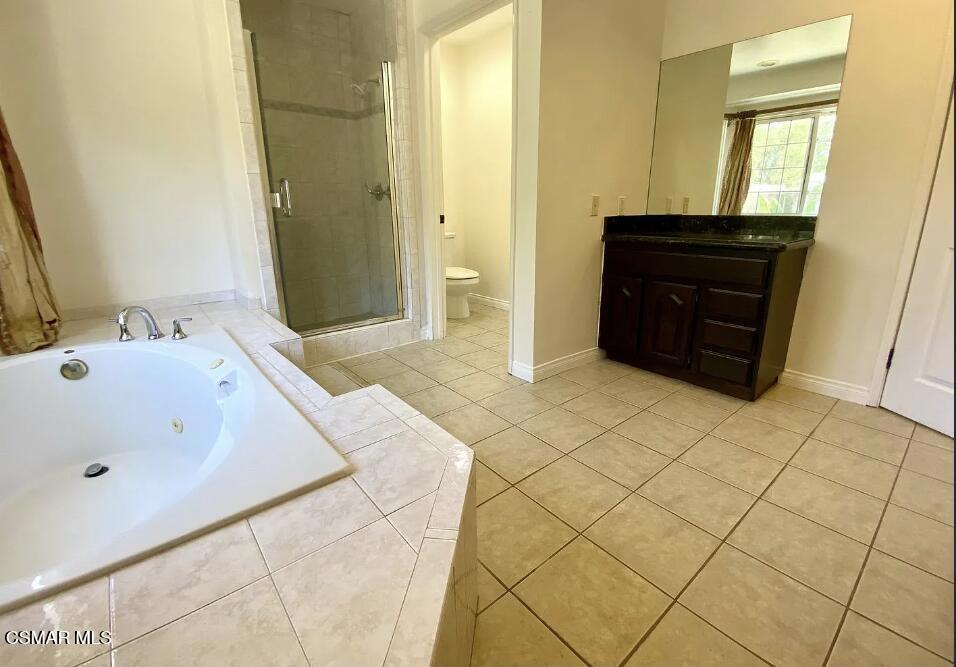 4130 Carrizal Road Woodland Hills, CA 91364 - Photo 23 of 33 a bathroom with a sink and a mirror