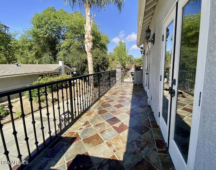 4130 Carrizal Road Woodland Hills, CA 91364 - Photo 31 of 33 a view of a balcony with wooden floor