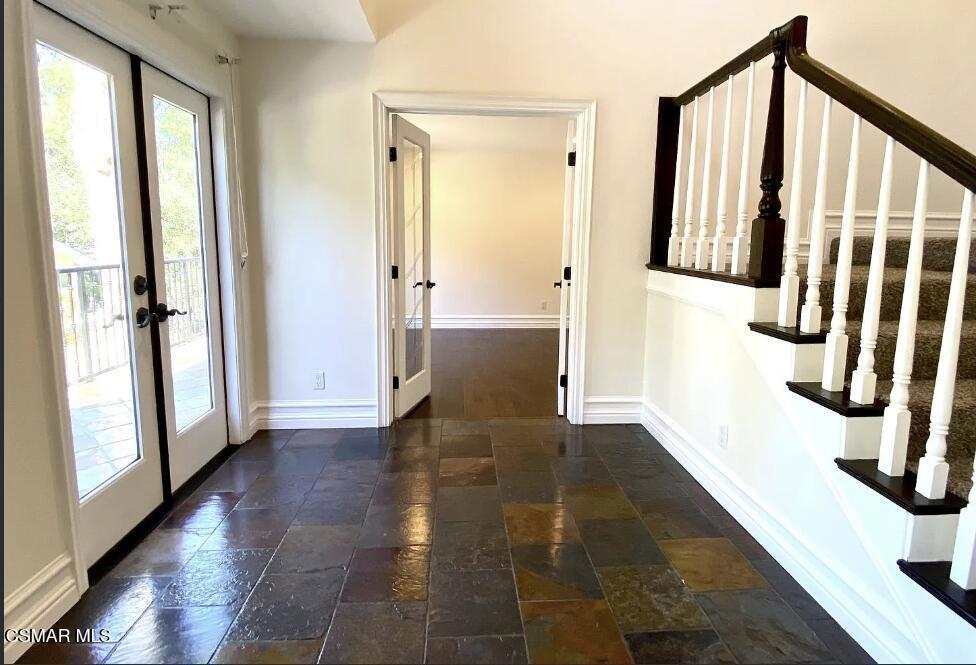 4130 Carrizal Road Woodland Hills, CA 91364 - Photo 4 of 33 a view of entryway with wooden floor and front door