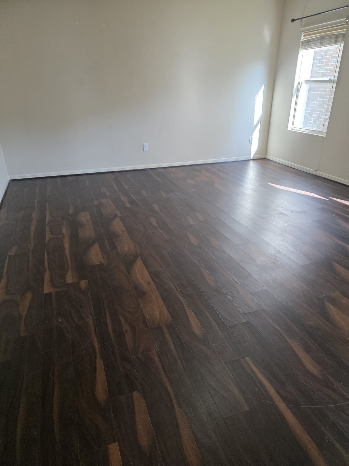 1023 Orie Court Spring, TX 77373 - Photo 10 of 28 an empty room with wooden floor and windows