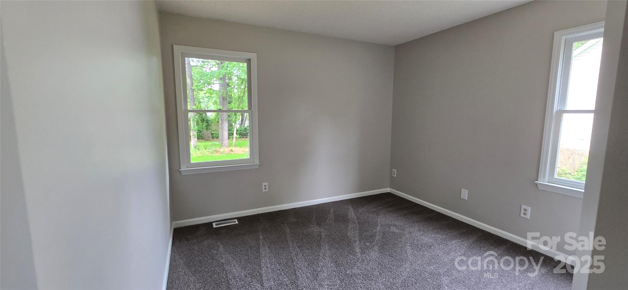 413 Parallel Drive Harrisburg, NC 28075 - Photo 11 of 40 an empty room with a window
