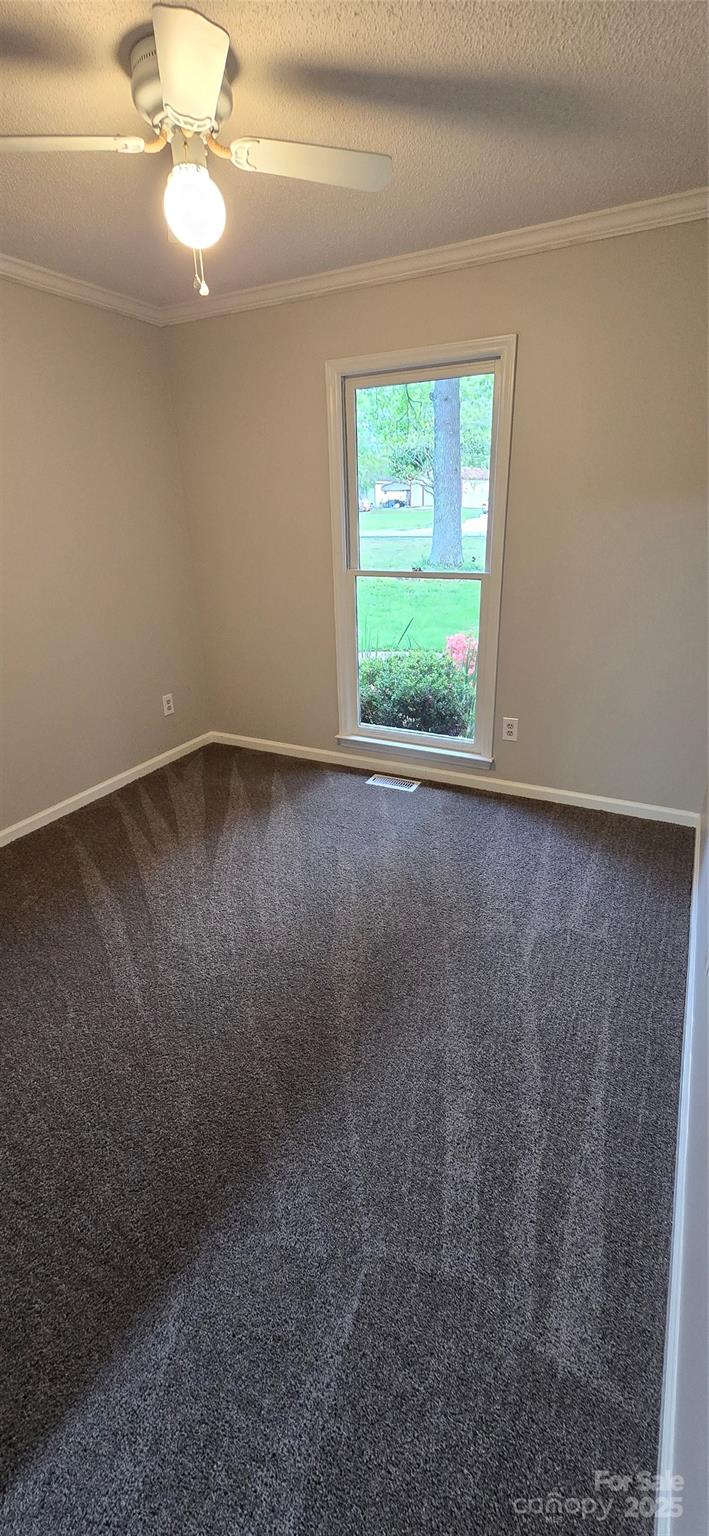 413 Parallel Drive Harrisburg, NC 28075 - Photo 22 of 40 wooden floor in an empty room with a window