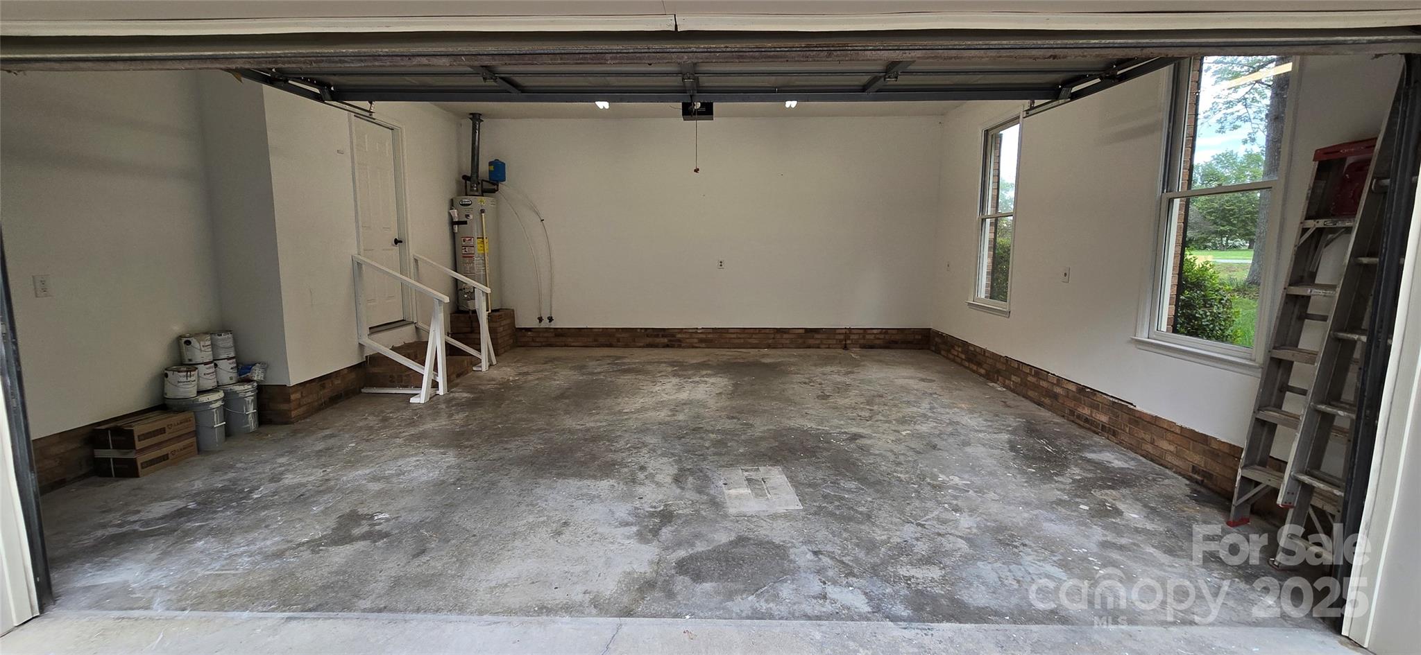 413 Parallel Drive Harrisburg, NC 28075 - Photo 27 of 40 a view of a room with wooden walls