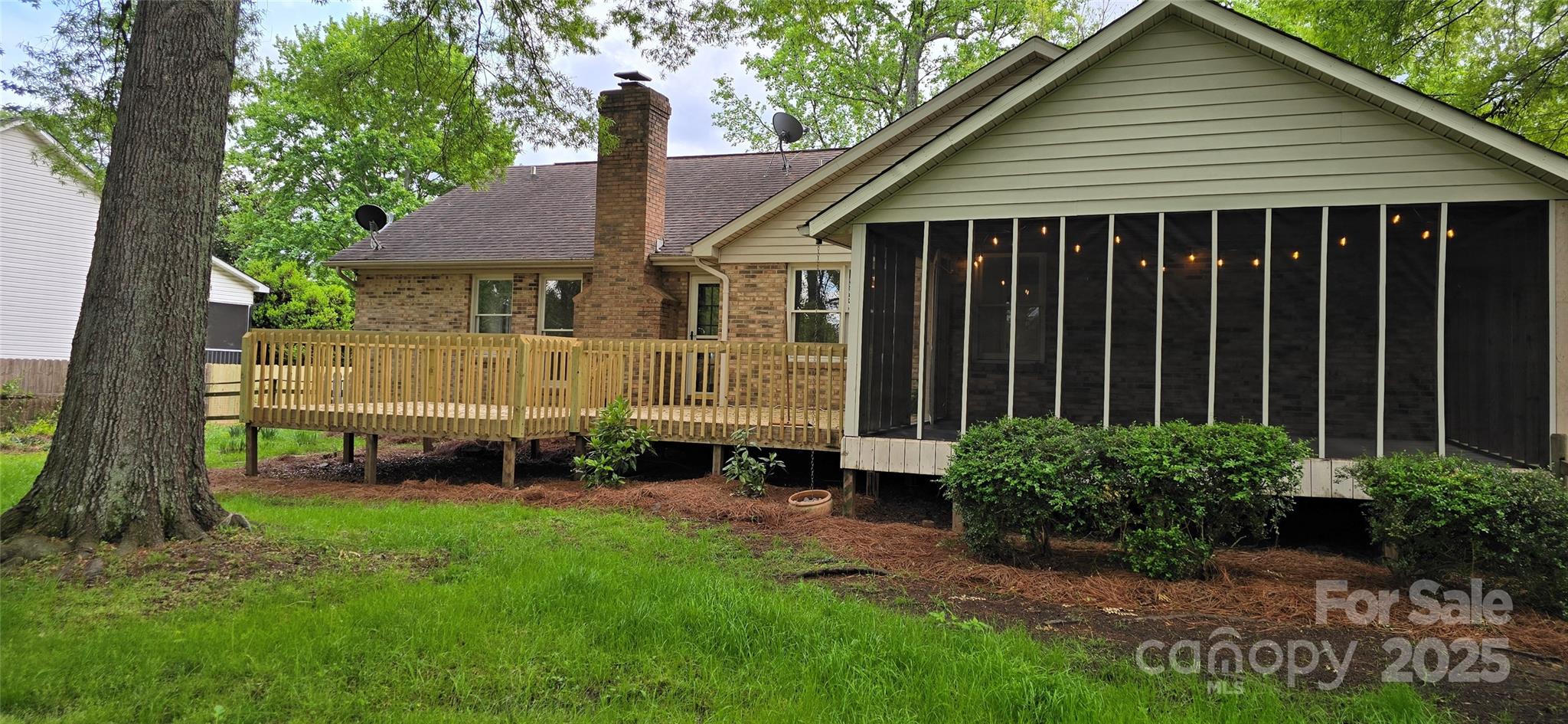413 Parallel Drive Harrisburg, NC 28075 - Photo 30 of 40 a front view of a house with garden