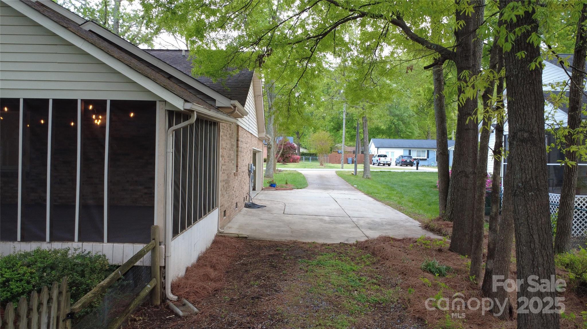 413 Parallel Drive Harrisburg, NC 28075 - Photo 31 of 40 a view of a house with backyard and porch