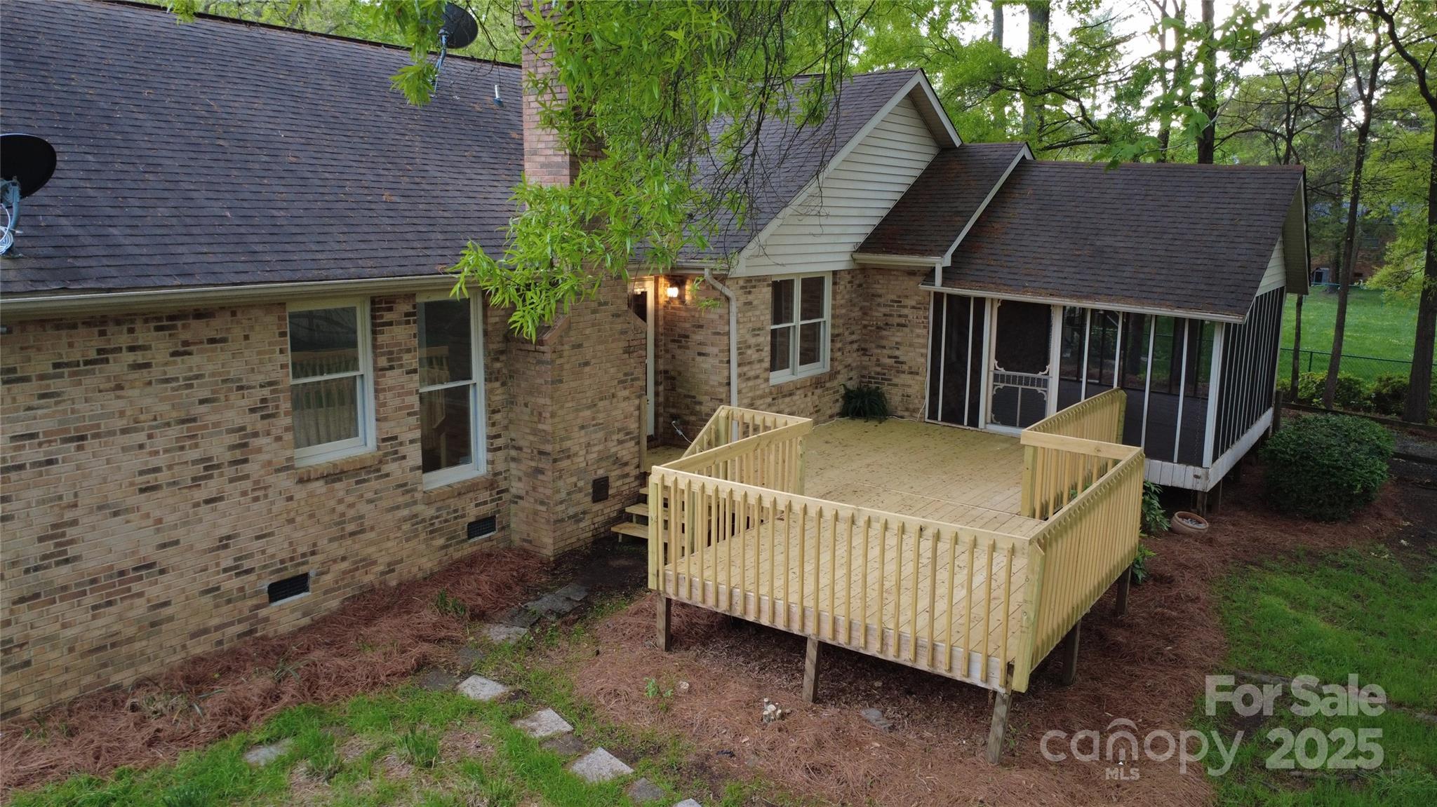 413 Parallel Drive Harrisburg, NC 28075 - Photo 36 of 40 a view of a house with a yard and deck area