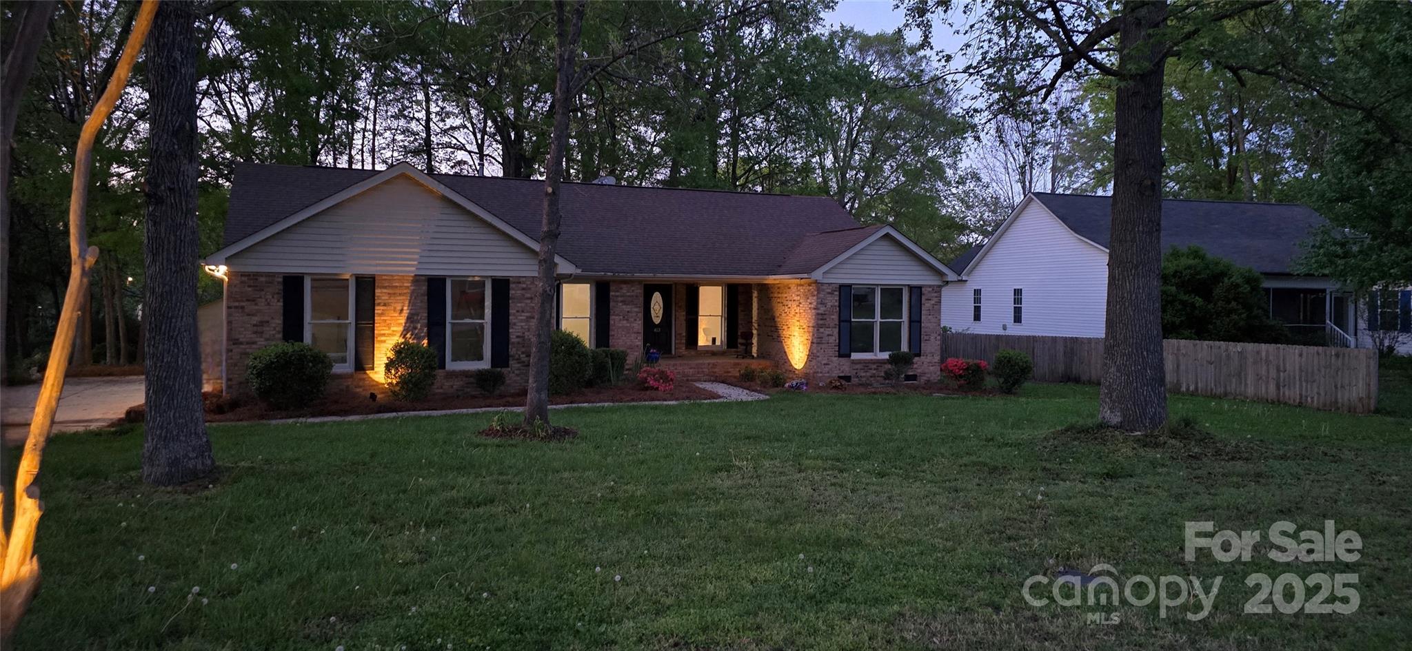 413 Parallel Drive Harrisburg, NC 28075 - Photo 37 of 40 a house that has a lot of plants in it