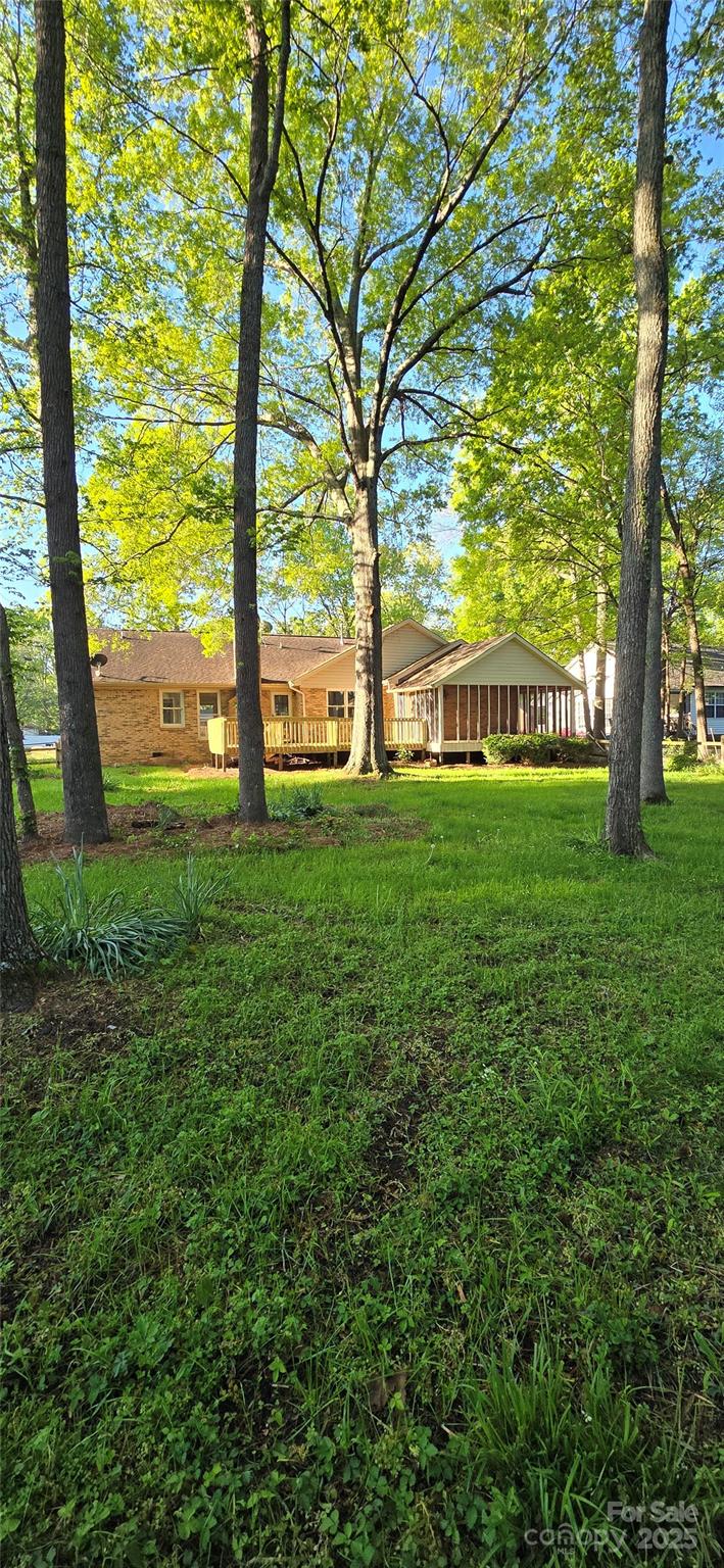 413 Parallel Drive Harrisburg, NC 28075 - Photo 38 of 40 a view of yard with swimming pool and green space