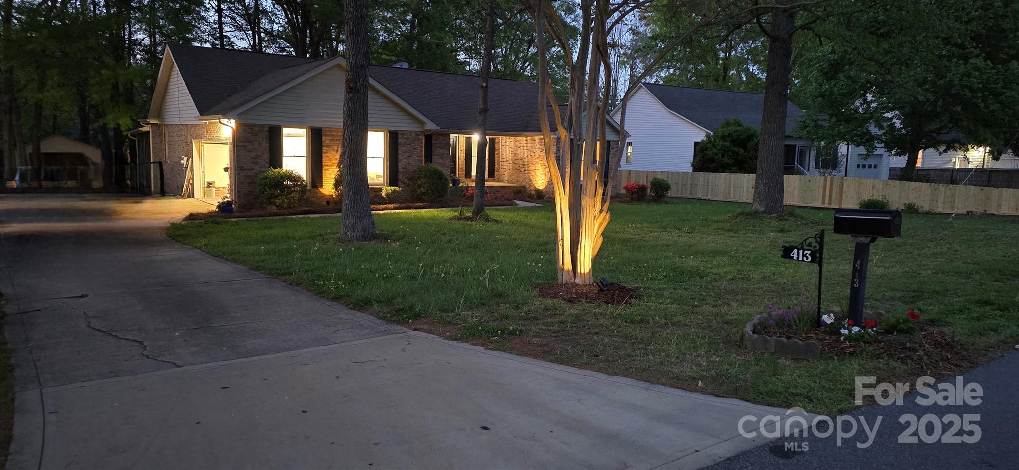 413 Parallel Drive Harrisburg, NC 28075 - Photo 39 of 40 a front view of a house with garden